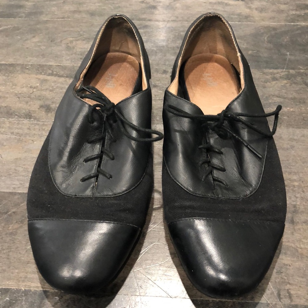 Black leather and canvas dress shoes